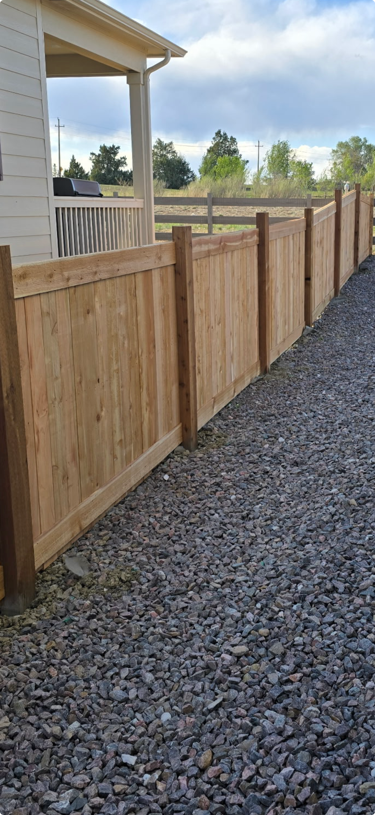 Wood fence with patio area — backyard fence installation by Gray Fencing, Northern Colorado