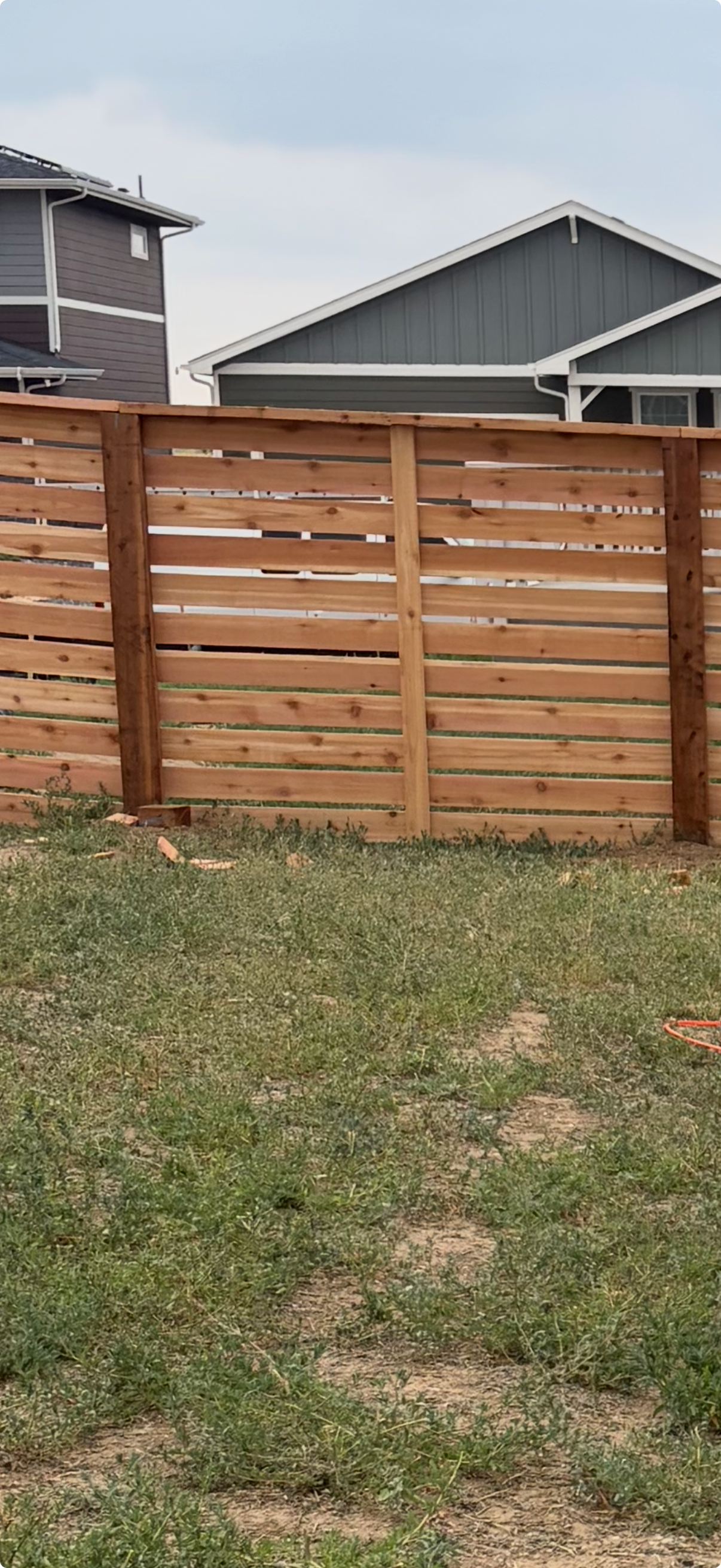 Cedar privacy fence along residential backyard in Fort Collins — Gray Fencing project