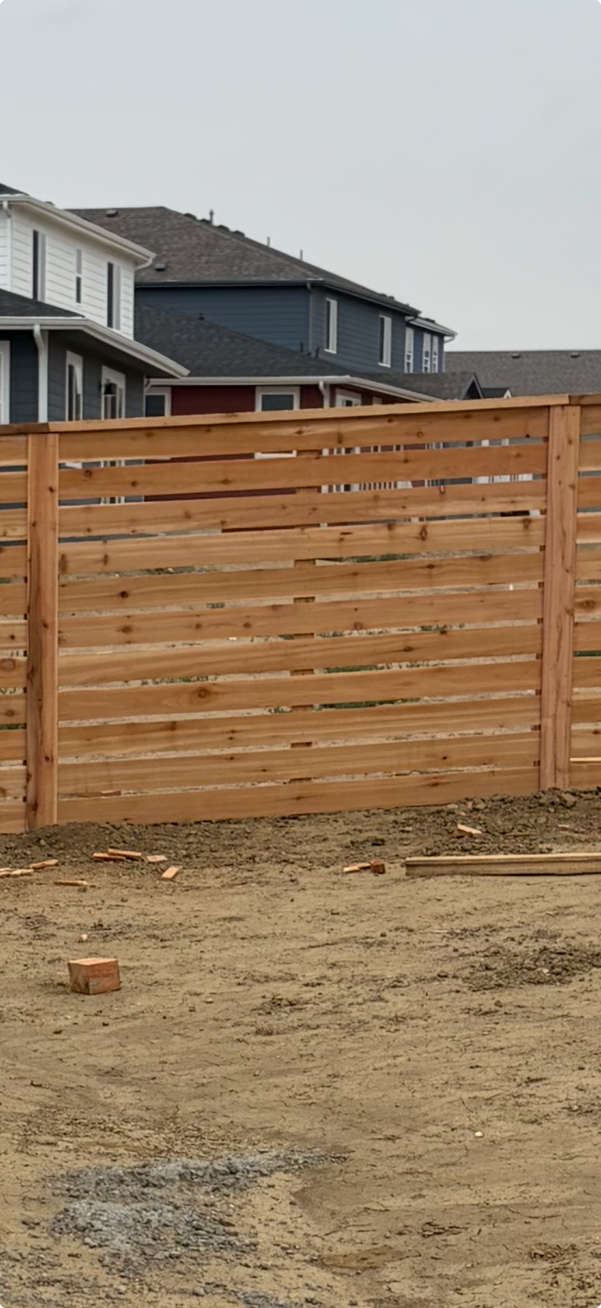 Natural cedar wood privacy fence installation